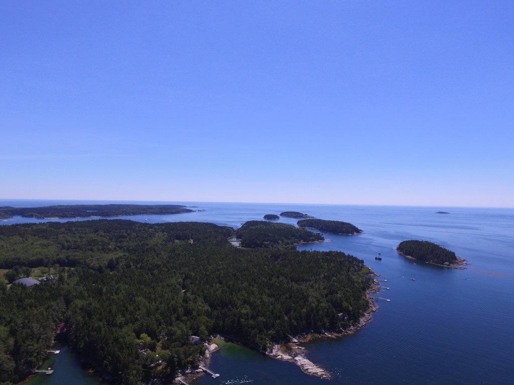 Aerial view of oceanfront vacation cottages on Long Cove in Phippsburg, Maine
